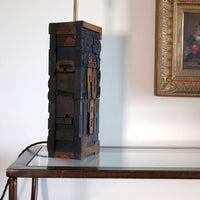 Close‑up of printing block letters forming lamp base