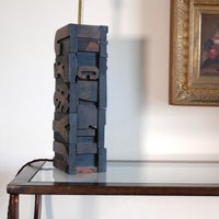 Close‑up of printing block letters forming lamp base
