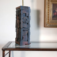 Close‑up of printing block letters forming lamp base