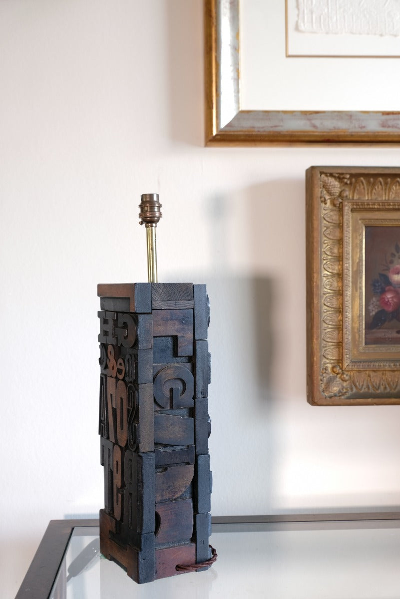 Close‑up of printing block letters forming lamp base