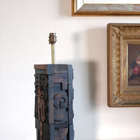 Close‑up of printing block letters forming lamp base