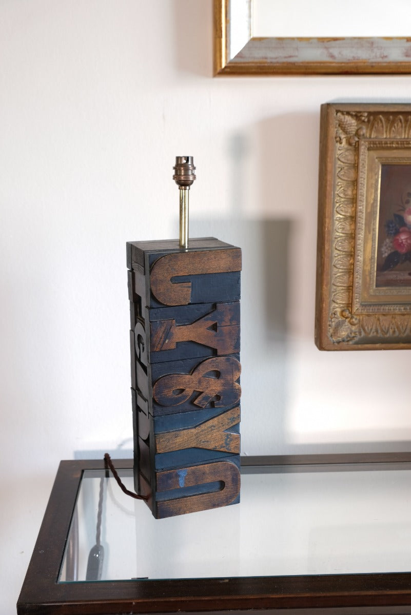 Close‑up of printing block letters forming lamp base