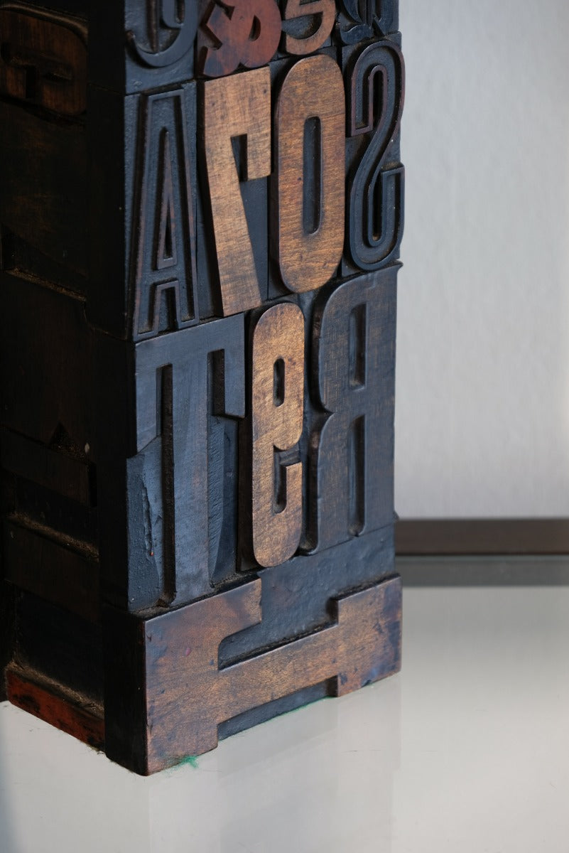 Close‑up of printing block letters forming lamp base