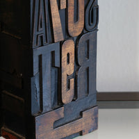 Close‑up of printing block letters forming lamp base