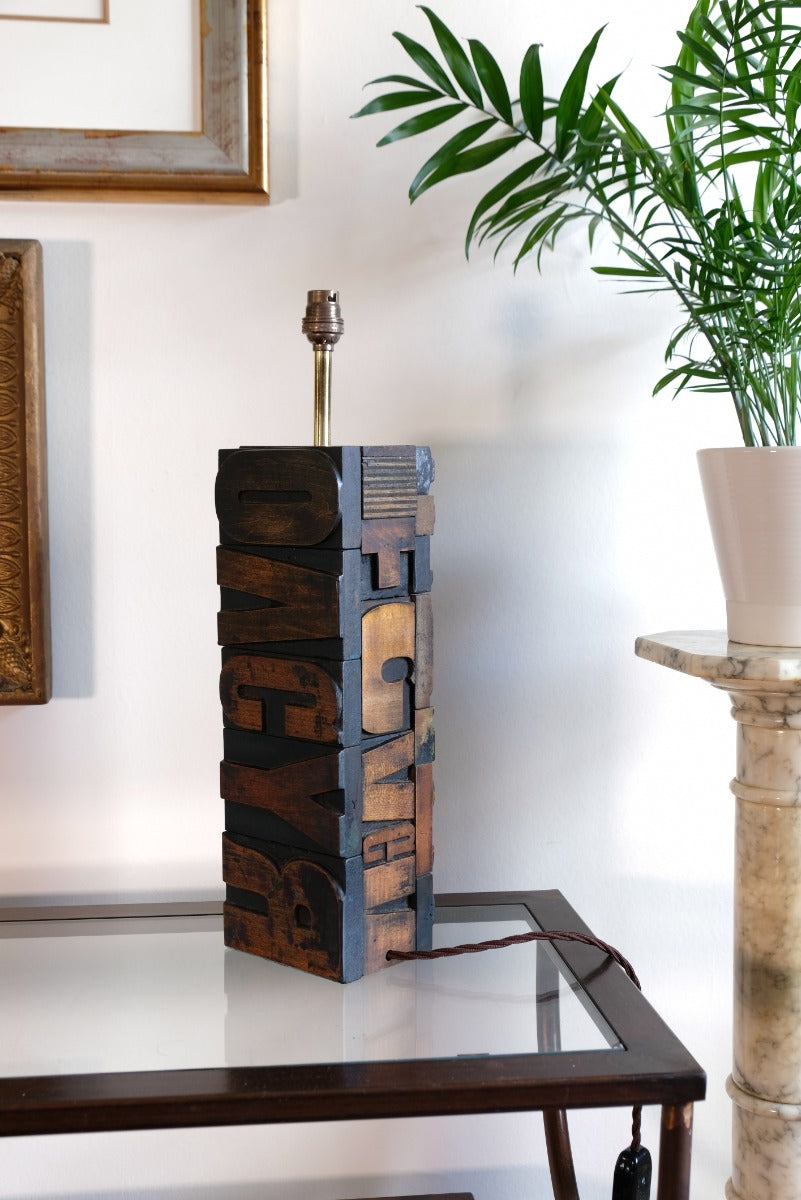 Close‑up of printing block letters forming lamp base