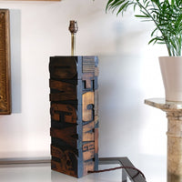 Close‑up of printing block letters forming lamp base