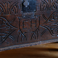 Charles II six-plank oak coffer chest with carved initials E.H., England c.1640–1660