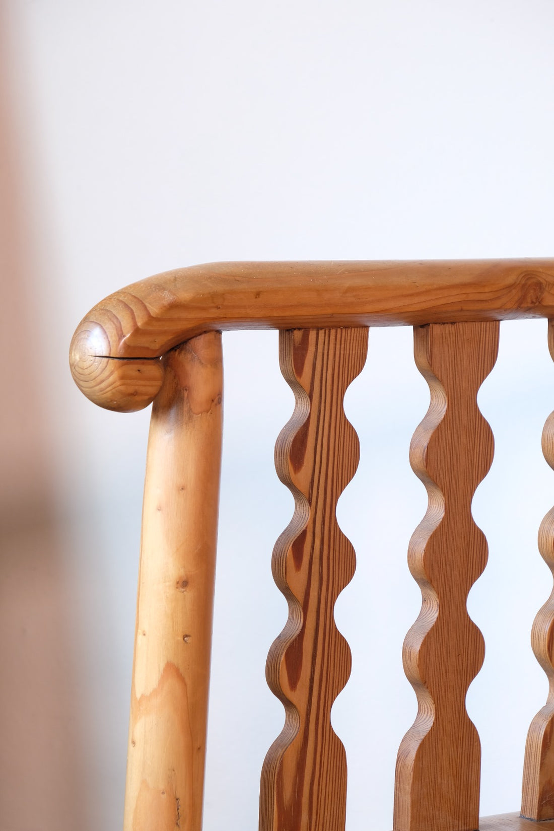 Hand‑curl armrest of pitch pine bobbin armchair