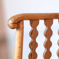Hand‑curl armrest of pitch pine bobbin armchair