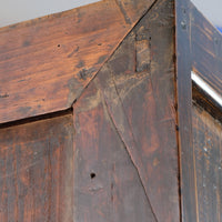 Close-up of antique Chinese storage drawers with hand-painted calligraphy