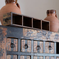 Antique Chinese storage cabinet in rustic layered orange and brown paint