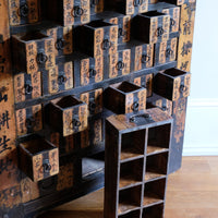 Close-up of drawers on an Antique Painted Chinese Apothecary-Style Cabinet with 57 Drawers and Calligraphy