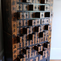 Antique Chinese storage cabinet in rustic layered orange and brown paint
