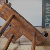 Underside showing rough elm grain and tool marks of the 1950s Spanish Brutalist primitive elm leather chair