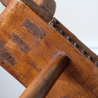 Underside showing rough elm grain and tool marks of the 1950s Spanish Brutalist primitive elm leather chair