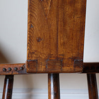 Back of the 1950s Spanish Brutalist primitive elm leather chair front view