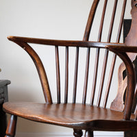 sweptback arms of a 19th Century Windsor Wheelback Armchair in Ash & Elm19th Century Windsor Wheelback Armchair in Ash & Elm