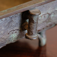 Aged bronze patina and verdigris surface on Tōun-sai Meiji suiban vessel