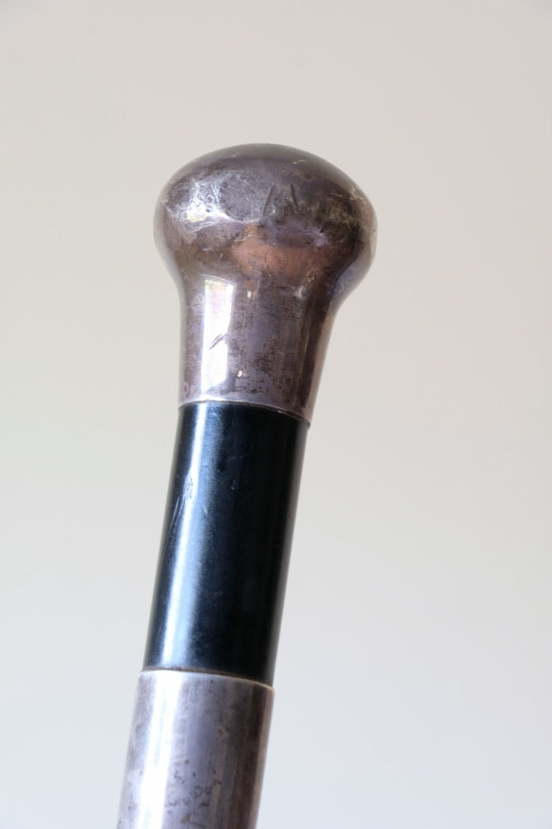 ebonised walking stick with hallmarked silver top and engraved plaque