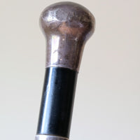 ebonised walking stick with hallmarked silver top and engraved plaque