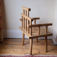 back view - Primitive handmade wooden armchair with rustic timber finish and blocky carved design
