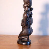 Kenyan ebony wood carving kneeling mother with child bundle