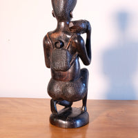 Kenyan ebony wood carving kneeling mother with child bundle