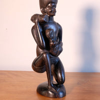 Kenyan ebony wood carving kneeling mother with child bundle