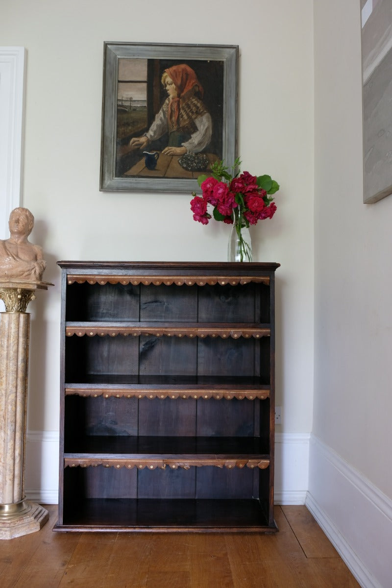 Edwardian carved oak bookcase with leather dust cover fringes