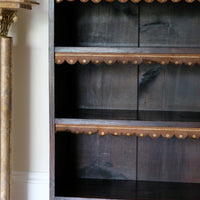 Original tooled leather scalloped fringe on fixed oak shelf