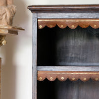 Edwardian carved oak bookcase with leather dust cover fringes