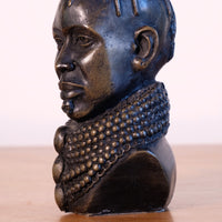 sculpture with textured beaded neck adornment