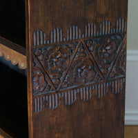 Edwardian carved oak bookcase with leather dust cover fringes
