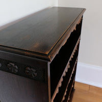 Edwardian carved oak bookcase with leather dust cover fringes