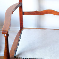 serpentine arms of the 19th century English vernacular furniture bench