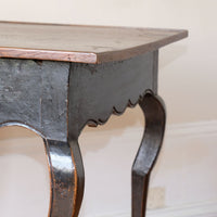 detail of carved hoof feet and cabriole legs on antique side table
