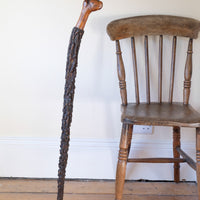 Antique Irish blackthorn walking stick with natural bark shaft and boxwood handle