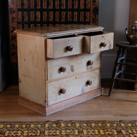 Top drawers open on a Victorian Pine Chest of Drawers – Two Small Over Two Deep