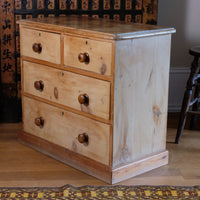 Angled view of a side view on a Victorian Pine Chest of Drawers – Two Small Over Two Deep