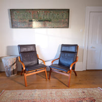 Pair of 1970s Danish Stouby bentwood leather lounge chairs with sculptural oak frames