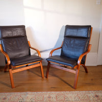 Pair of 1970s Danish Stouby bentwood leather lounge chairs with sculptural oak frames
