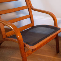 Cushion support of a Pair of 1970s Danish Stouby bentwood leather lounge chairs with sculptural oak frame