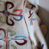 Vintage Uzbek Suzani kilim rug with embroidered floral medallions and vine scroll border, 173 x 230cm