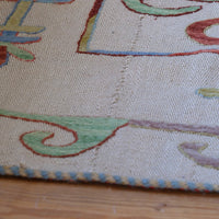 Vintage Uzbek Suzani kilim rug with embroidered floral medallions and vine scroll border, 173 x 230cm