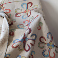 Vintage Uzbek Suzani kilim rug with embroidered floral medallions and vine scroll border, 173 x 230cm