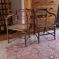 Pair of Regency mahogany armchairs with brass inlay and cane seats, circa 1810
