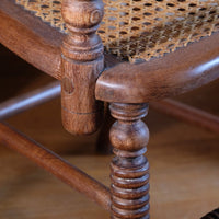 seat joint on a Pair of Regency mahogany armchairs with brass inlay and cane seats, circa 1810