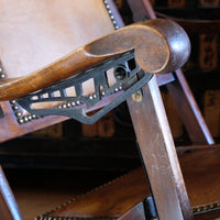 close up of the cast adjustable arm - Victorian brass studded leather folding campaign chair reclining armchair circa 1875