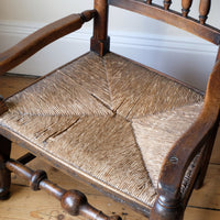 Rush seat on an Antique Lancashire Oak Spindle Back Armchair with Rush Seat, 19th Century North Country Chair