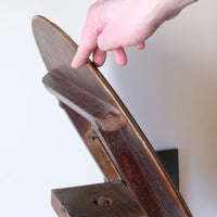 Tilting mechanism of a Late Victorian mahogany oval tilt-top tripod table with open reed column detail